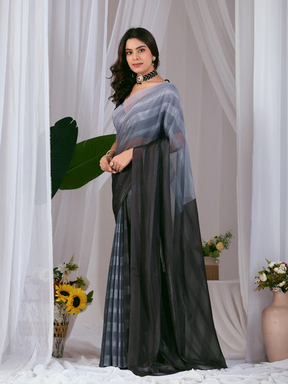 Premium Monsoon Saree featuring a classy Silk blend of deep black and smoky grey tones with a silky smooth flow, designed to deliver a bold, elegant, and timeless look.