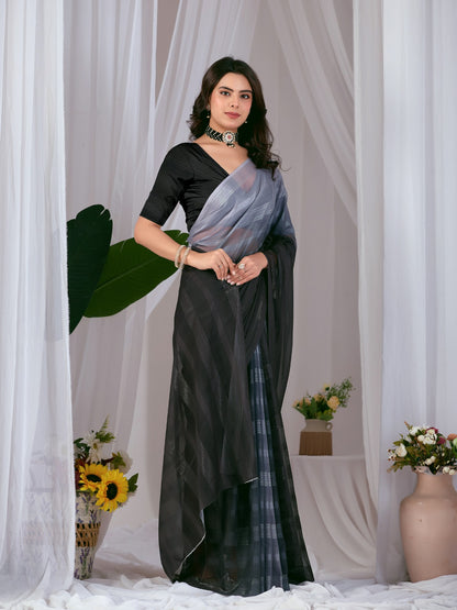 Premium Monsoon Saree featuring a classy Silk blend of deep black and smoky grey tones with a silky smooth flow, designed to deliver a bold, elegant, and timeless look.