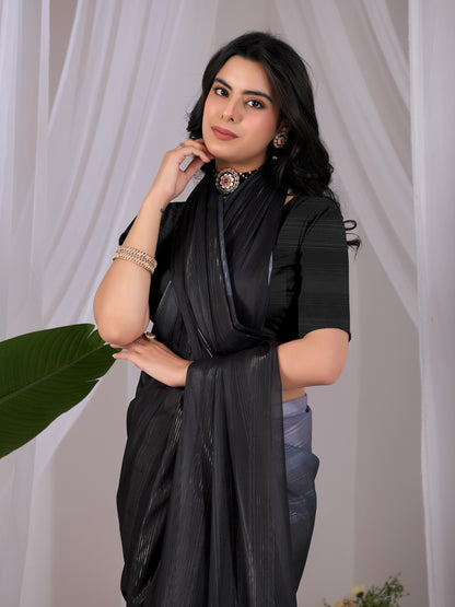 Premium Monsoon Saree featuring a classy Silk blend of deep black and smoky grey tones with a silky smooth flow, designed to deliver a bold, elegant, and timeless look.