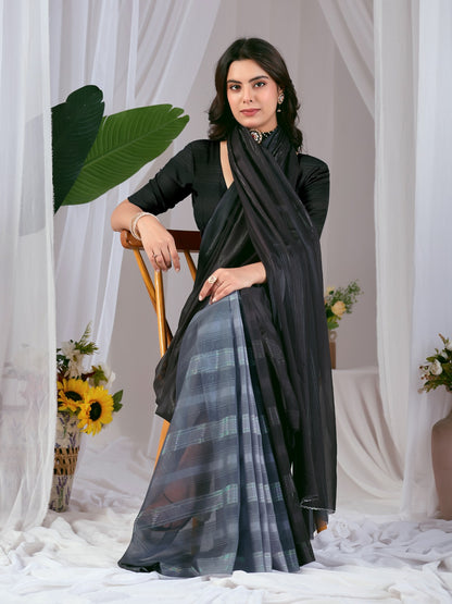 Premium Monsoon Saree featuring a classy Silk blend of deep black and smoky grey tones with a silky smooth flow, designed to deliver a bold, elegant, and timeless look.