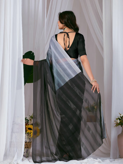 Premium Monsoon Saree featuring a classy Silk blend of deep black and smoky grey tones with a silky smooth flow, designed to deliver a bold, elegant, and timeless look.