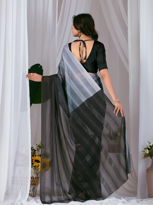 Premium Monsoon Saree featuring a classy Silk blend of deep black and smoky grey tones with a silky smooth flow, designed to deliver a bold, elegant, and timeless look.